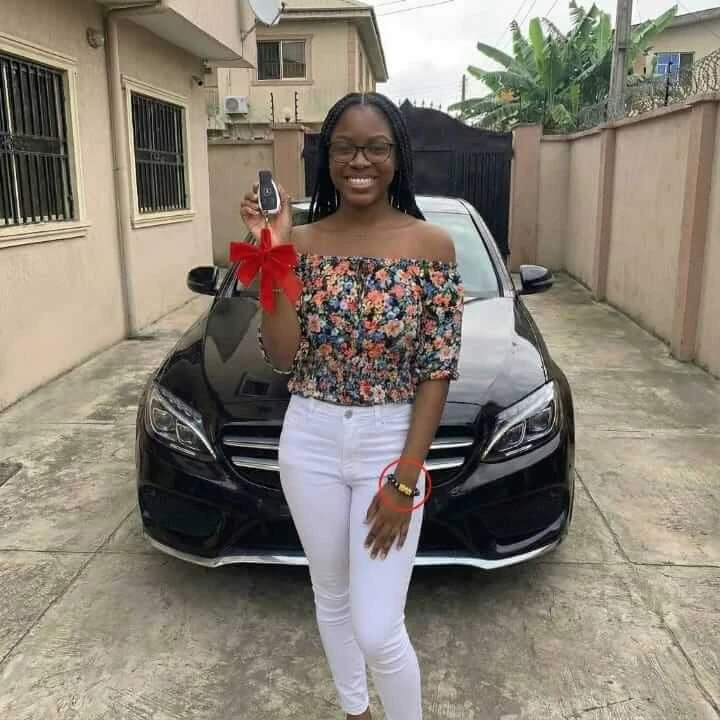 Zenda customer with her new car, Pixiu bracelet on her wrist